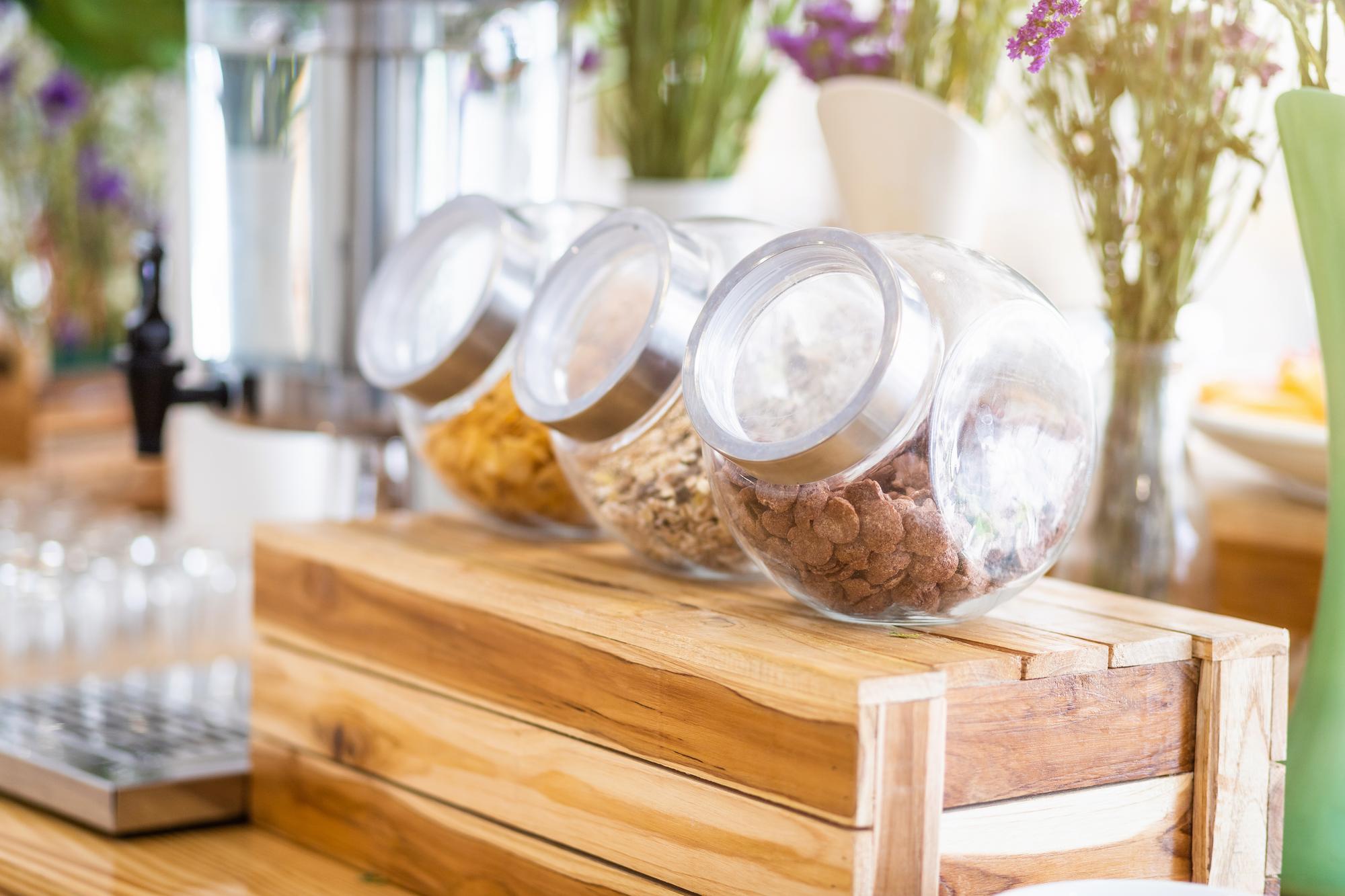 Small kitchen counter with jars and herbs