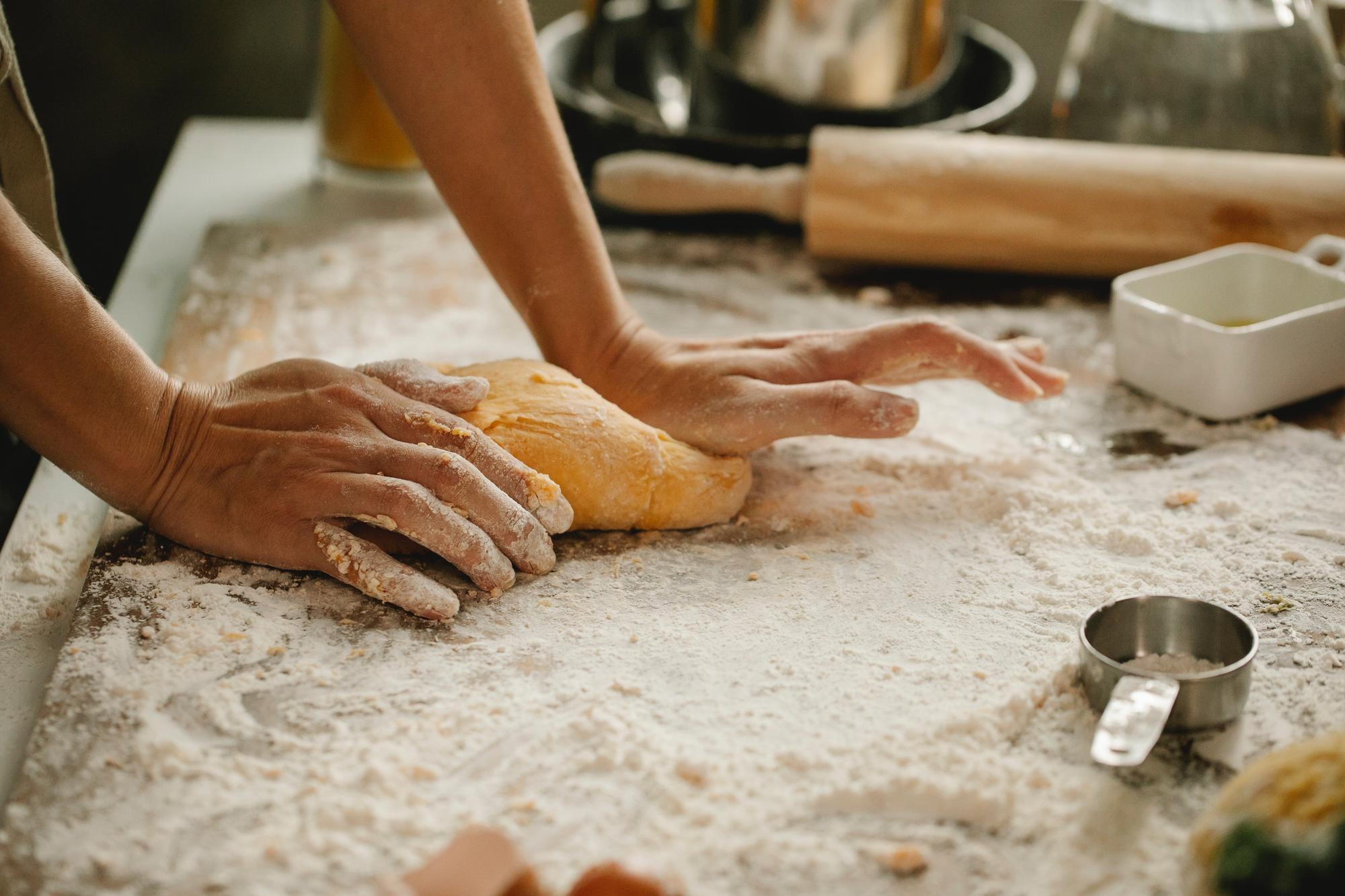 Hands kneading dough